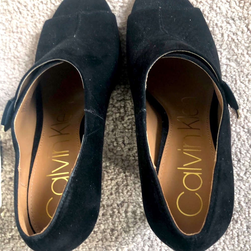 Black peeped toe boots with gold buckles